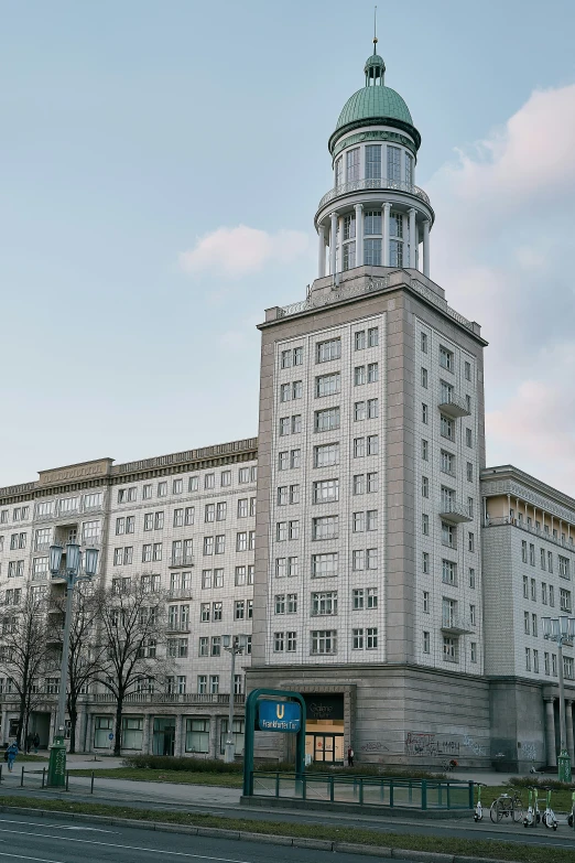 an old building with a clock tower in the middle of it