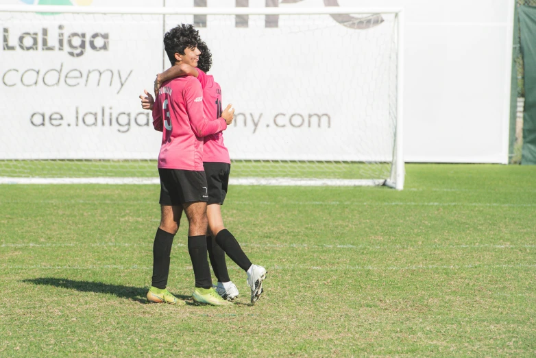 two young soccer players on the soccer field