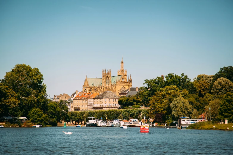 an image of a large castle by some water