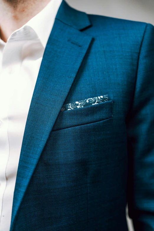 the shirt and tie of a man in a blue suit