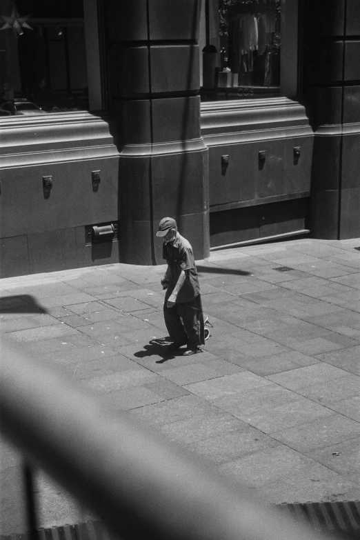 black and white pograph of a person riding a skate board