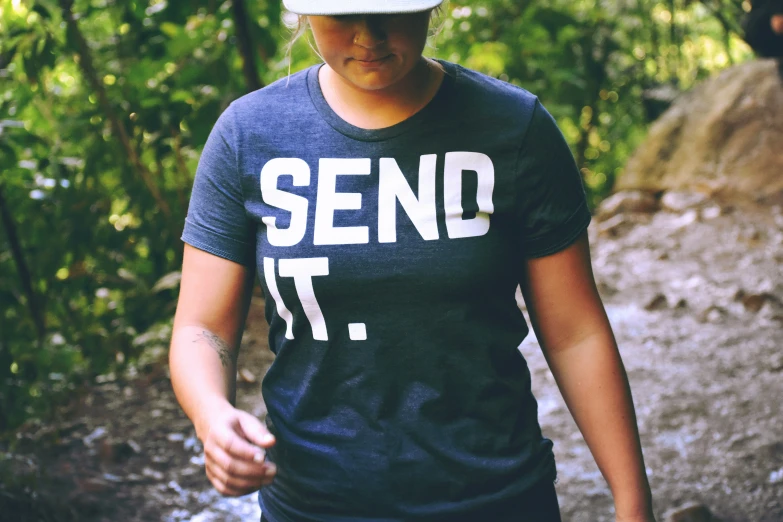 the person in the cap is walking through a forest