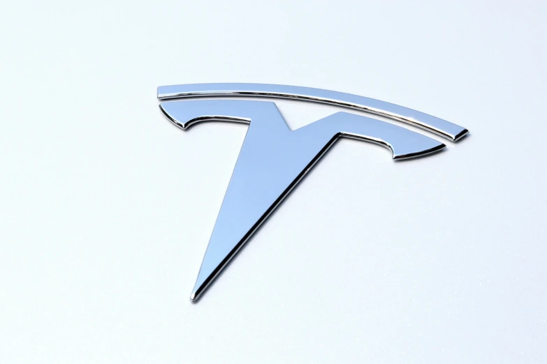 a large blue car emblem mounted to the side of a car