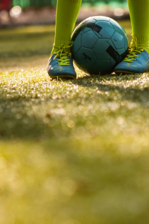 the soccer player is wearing blue and yellow socks