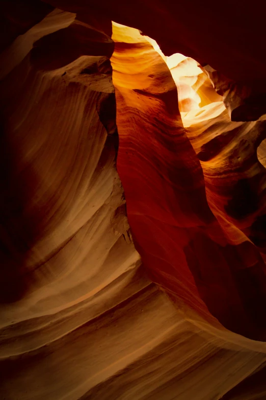 looking up into a narrow slot in an arid canyon