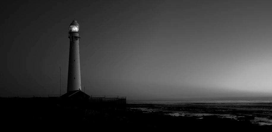 a black and white picture of a lighthouse