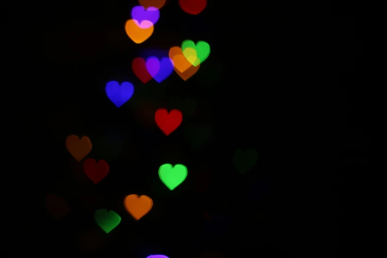 blurry image of multiple heart shaped lights