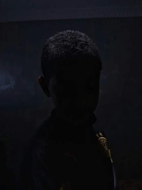 the profile of a man in silhouette with an electronic cigarette in his ears