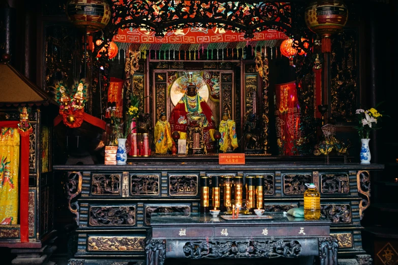 an ornate shrine with lights and decorations in it