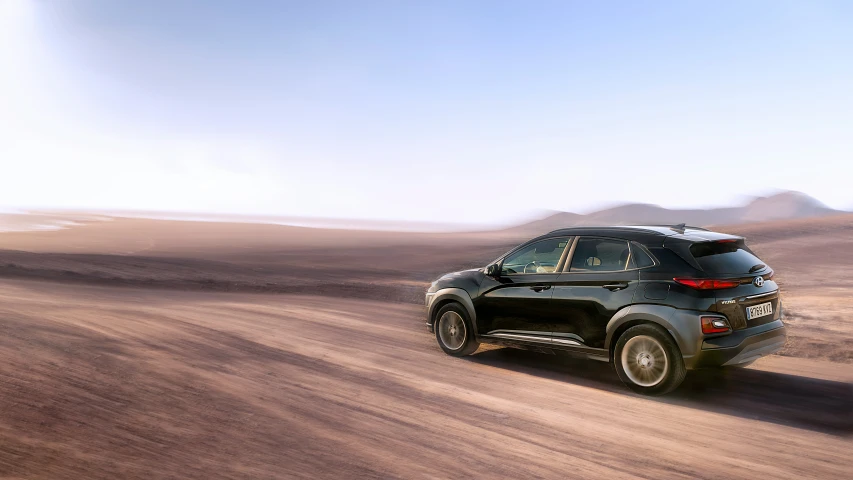 an suv driving in the desert with fog