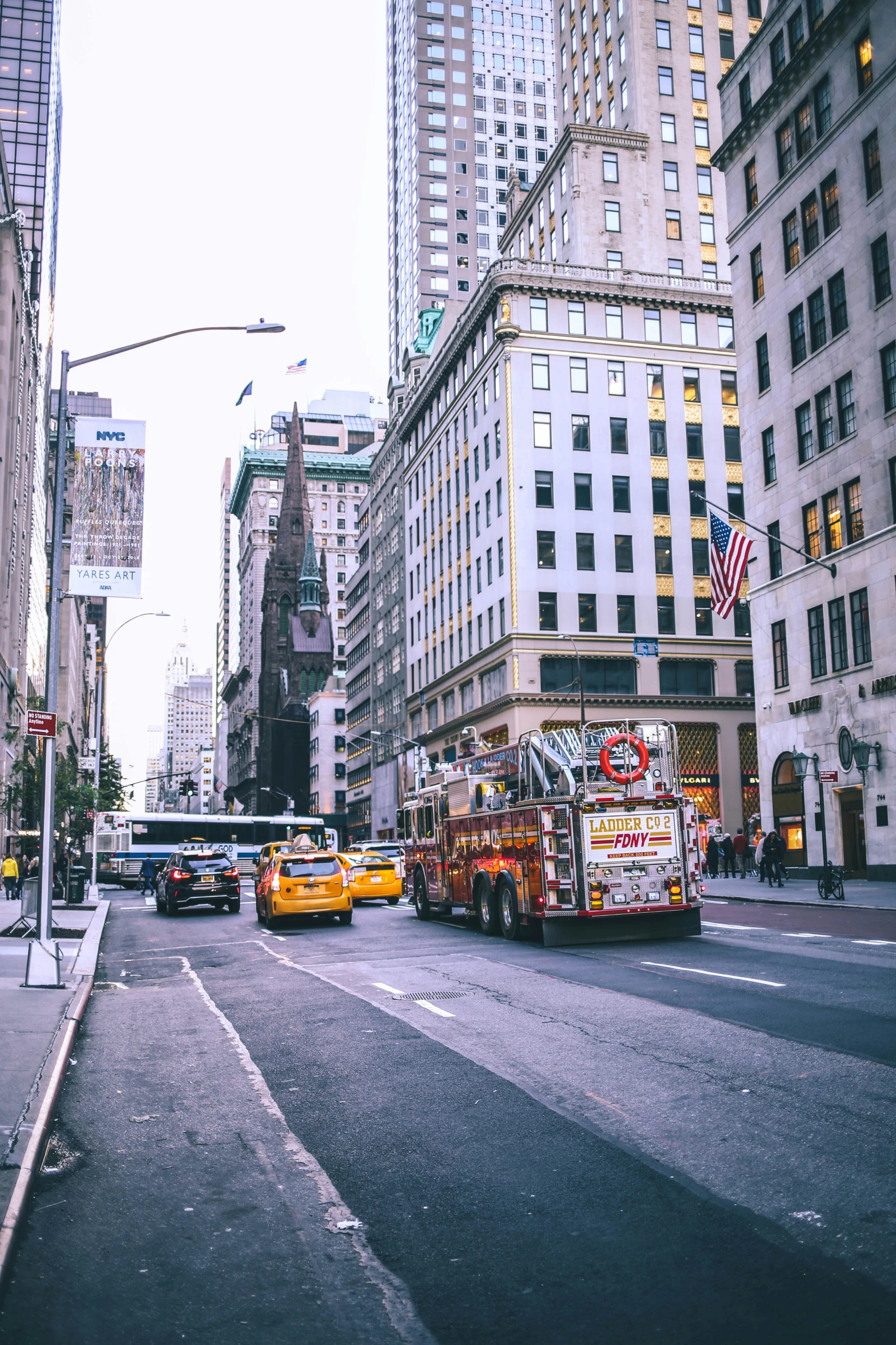 the road is busy with cars and busses