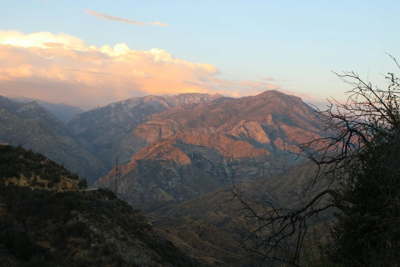 a view of a mountain range and clouds