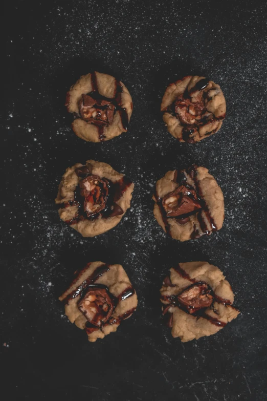 five cookies are laying on a table