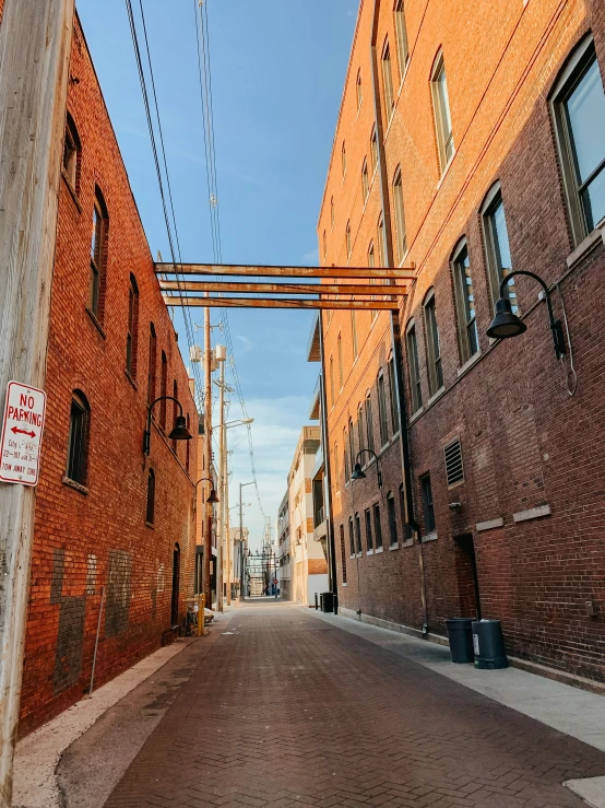 a city street lined with tall brick buildings