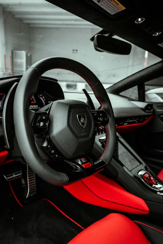 the inside of a sports car in red and black leather