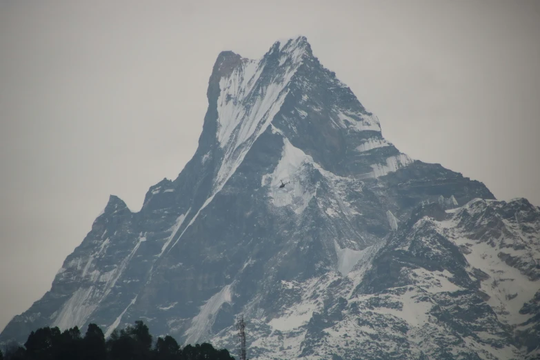 a view of a snow capped mountain with a clear sky