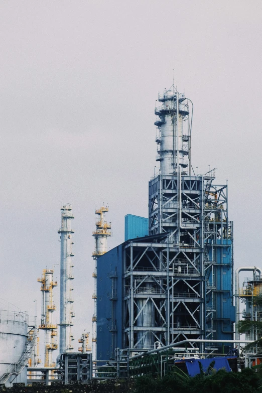 industrial plants and buildings in front of a gray sky