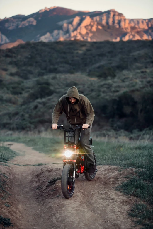 a guy is riding his bike in the wild