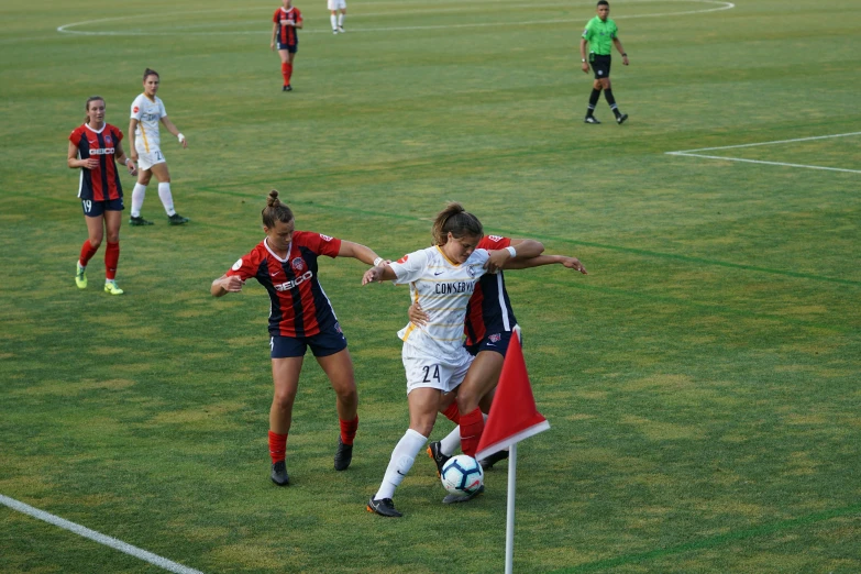 a soccer game with the ball in the air