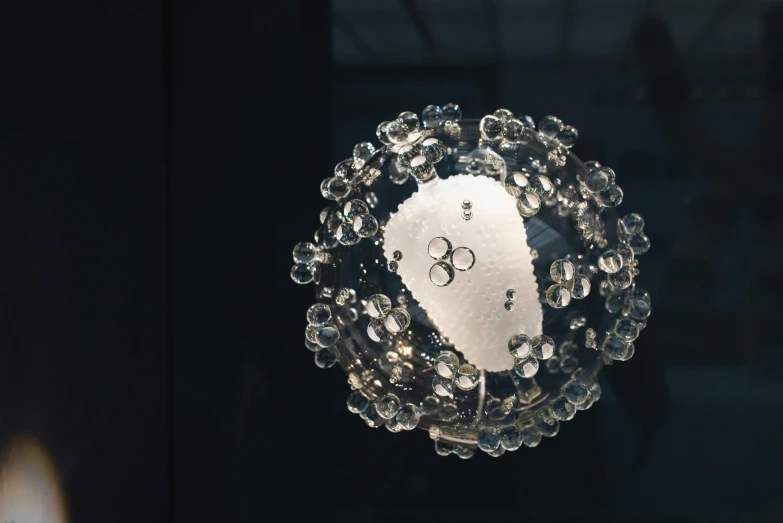 close up of a crystal circular decoration with cross and stars