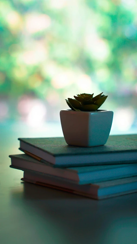 stack of three different books stacked on top of each other