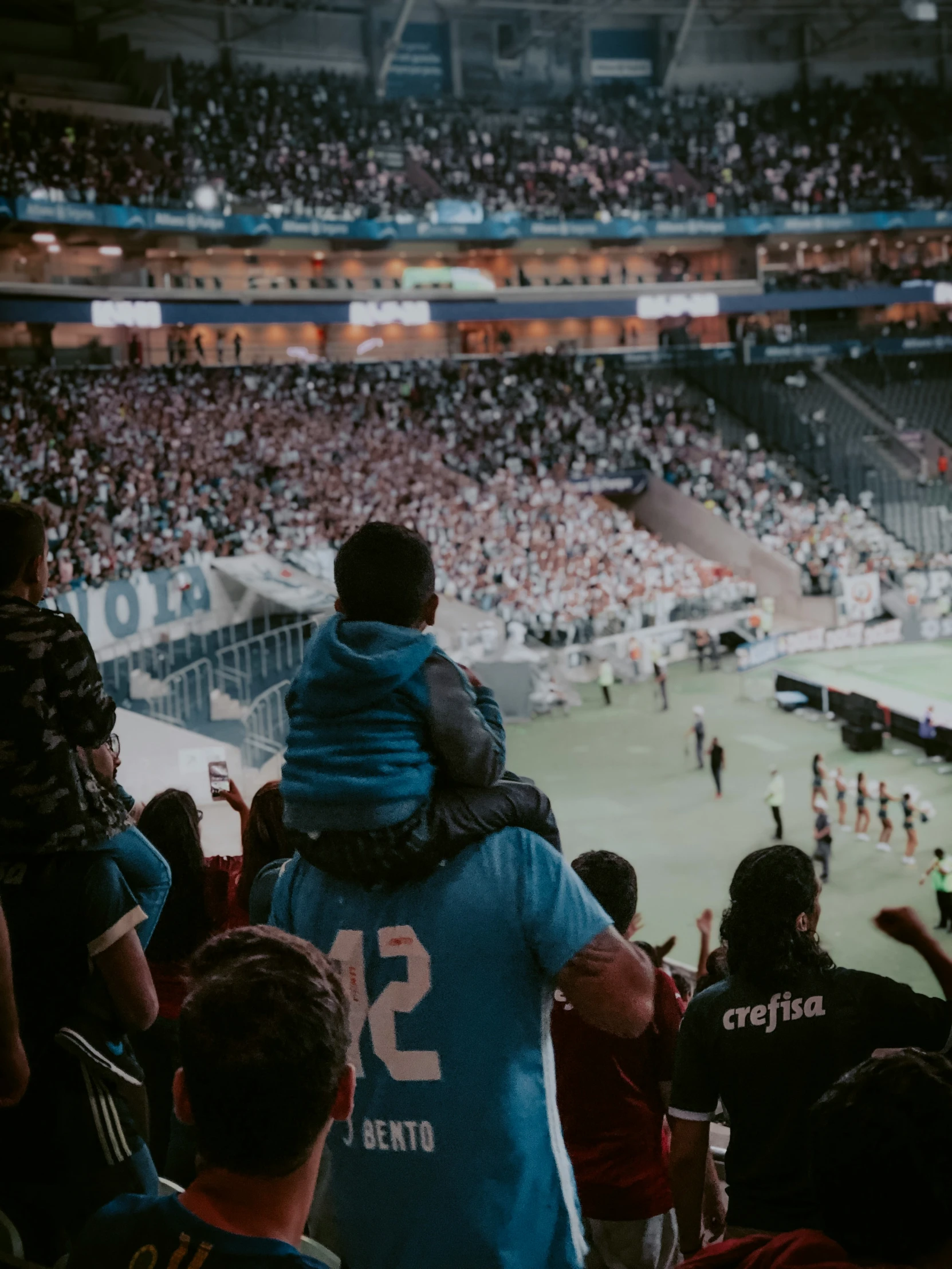 a crowd at a sporting event at night