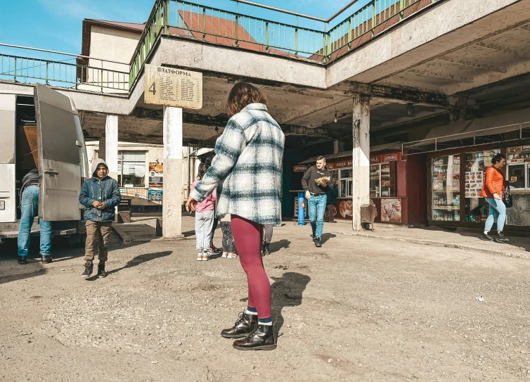 people walking out of the subway at a station