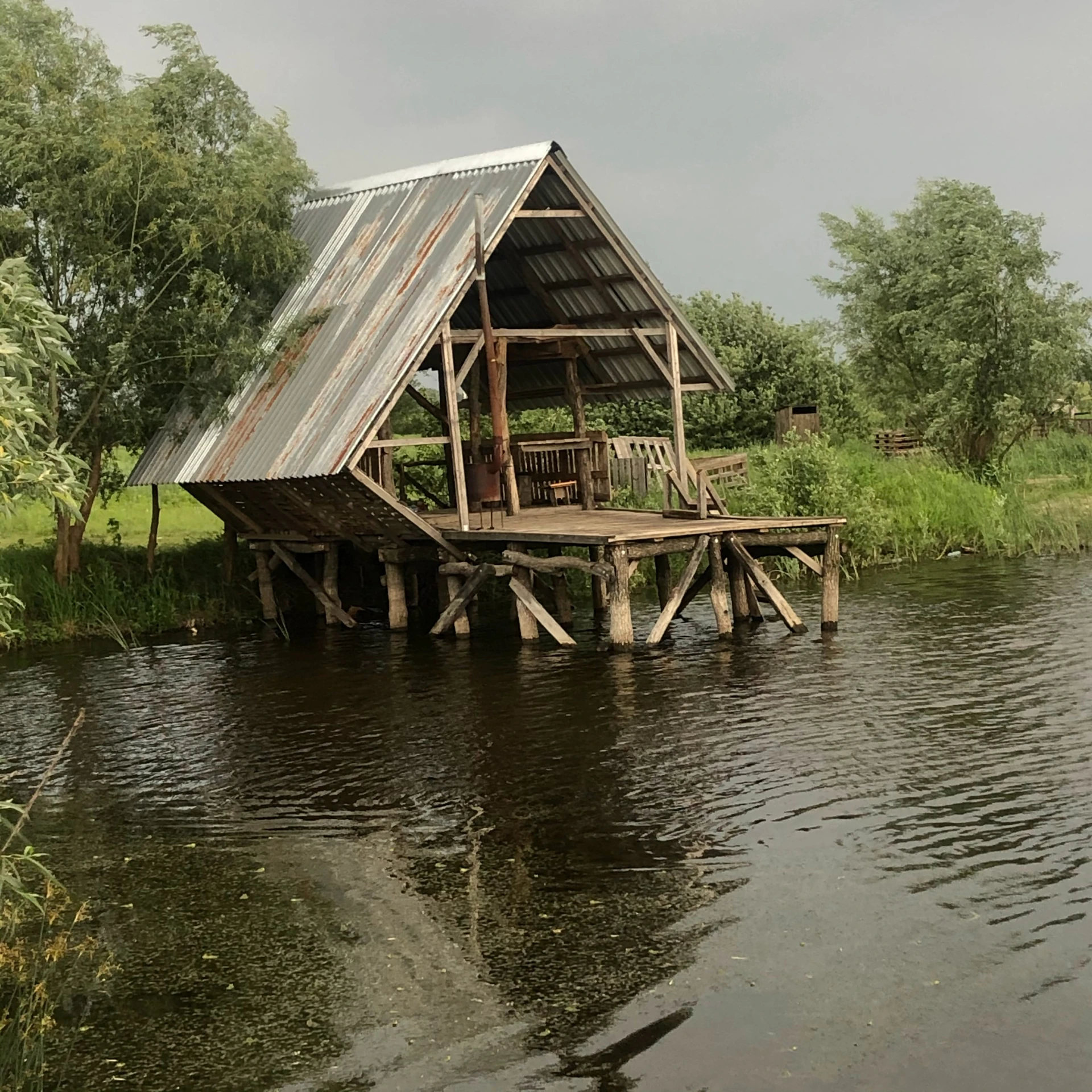 an hut built to sit on the edge of a body of water