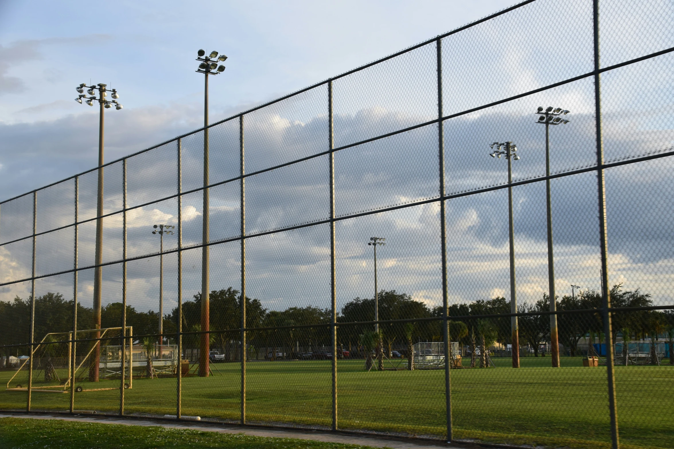 the soccer field is lined with tall poles