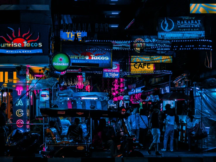 many neon lights are on the city street