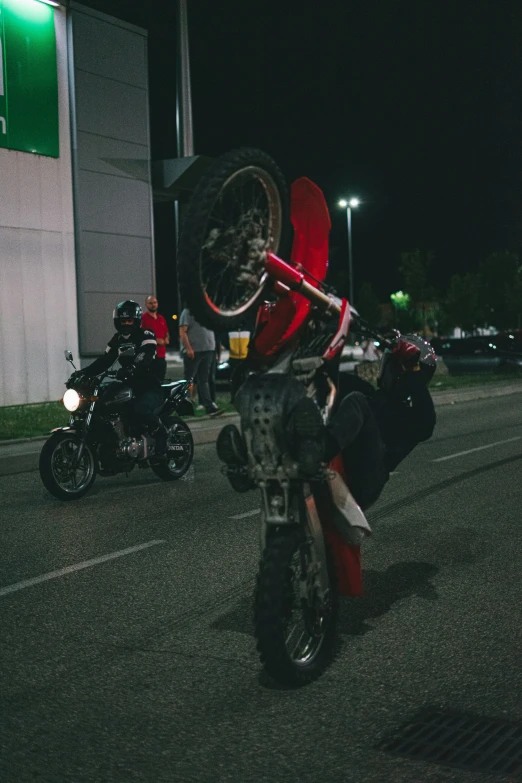 a person riding on the back of a motor bike