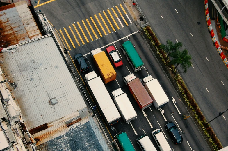 several cars parked next to each other in an urban area