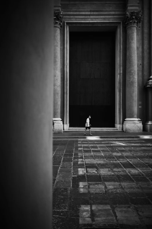 a small child in front of an entrance