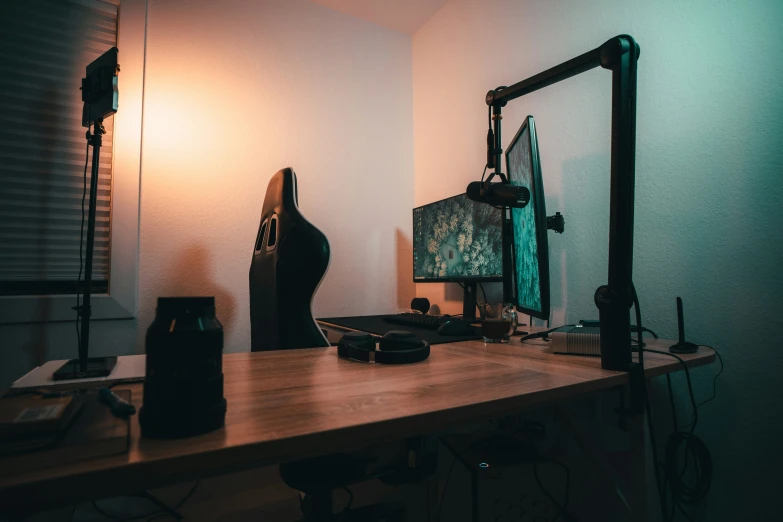 a desk with musical instruments on it and a wall light