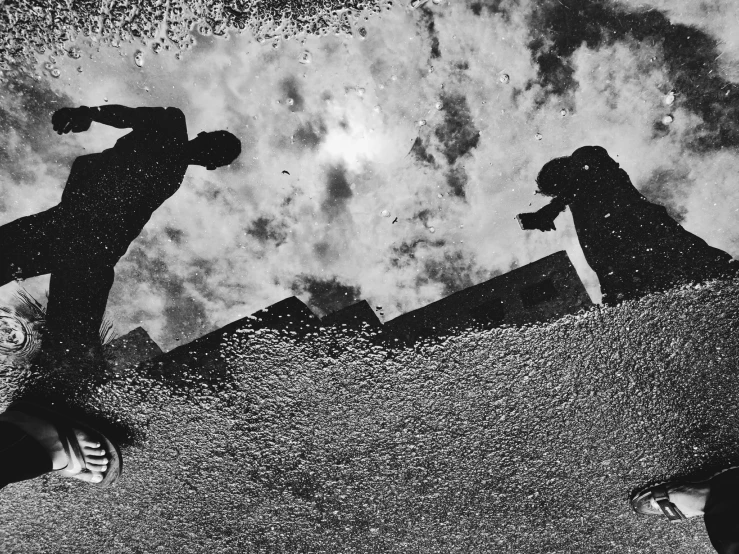 two people in a black and white po skateboarding