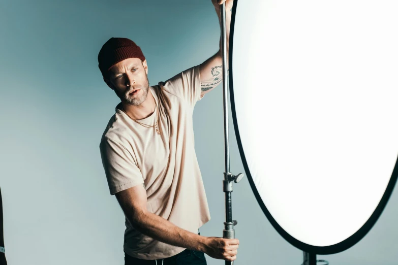 a man holding an umbrella behind it by the camera