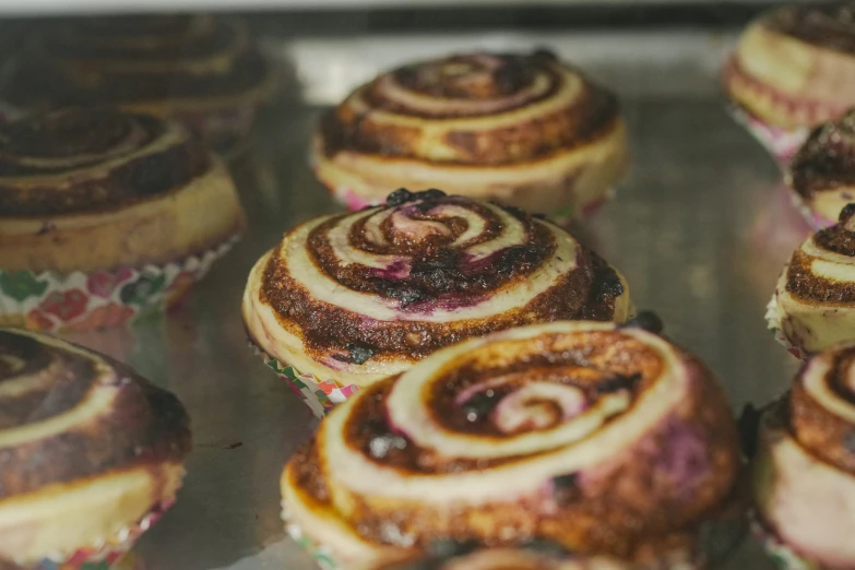 rolls with blueberries and nuts in a pan