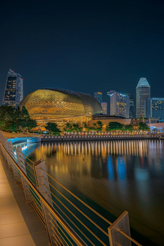 a view of a city with a bridge at night