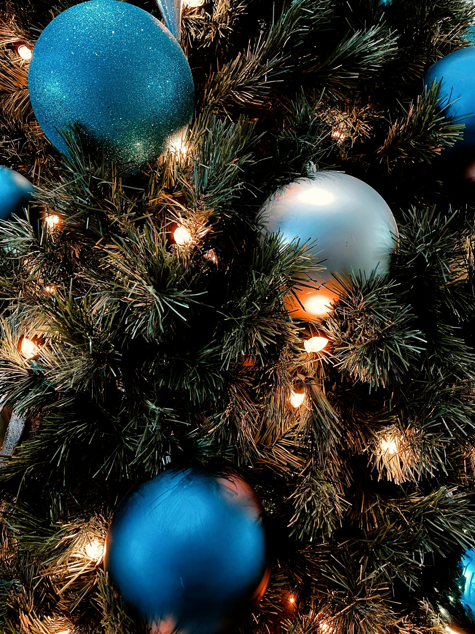 ornaments of christmas trees in silver and blue shades