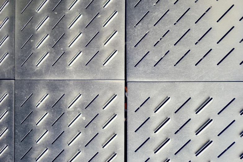 a sidewalk with a grungy surface that looks like a diamond pattern