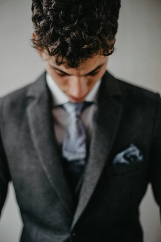 a close up of a man in a suit