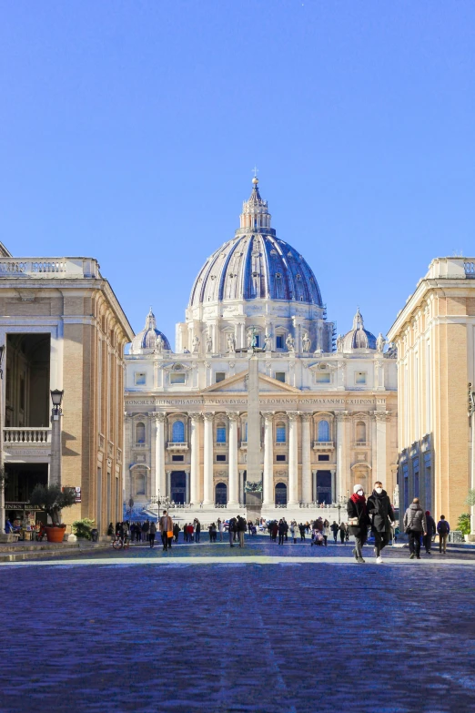 a building with many columns and dome, in the foreground