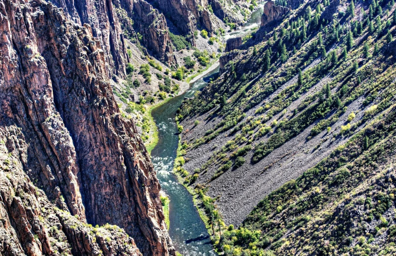 the canyon floor at black canyon national park is made up of rocky cliffs and water