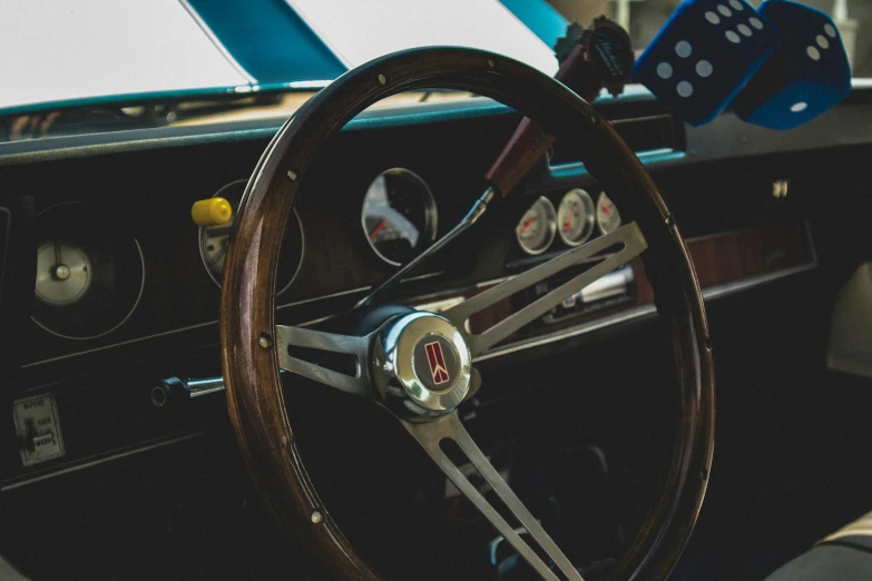 a car dashboard with a steering wheel and a few other items