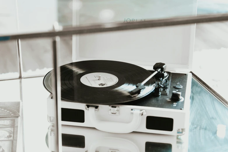 a record player sits on top of the clock