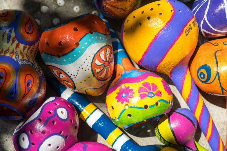 there are many painted easter eggs laying in the bin