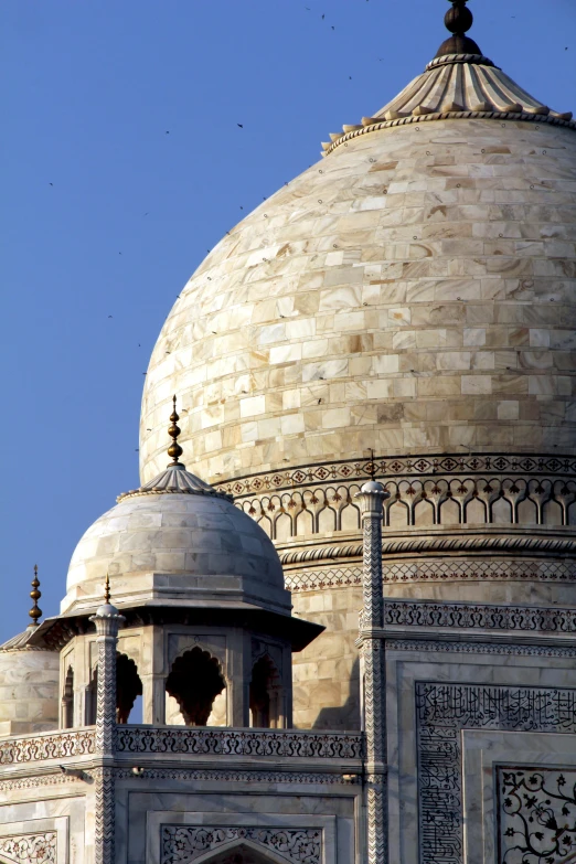 an ornate white building with a domed structure