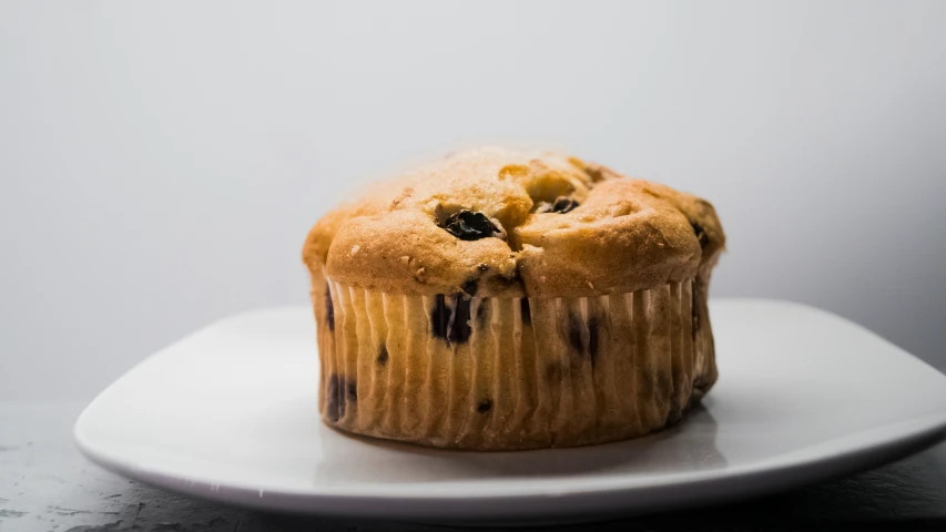 a cake with blueberries and blackberries on it