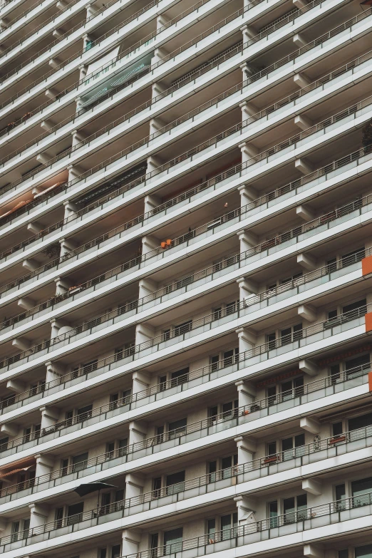 large apartment building next to street in a city