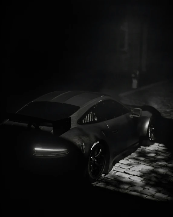 a car sits outside on the ground in the dark